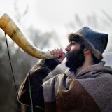 Tradition - Viking man blowing a horn by Edwin H