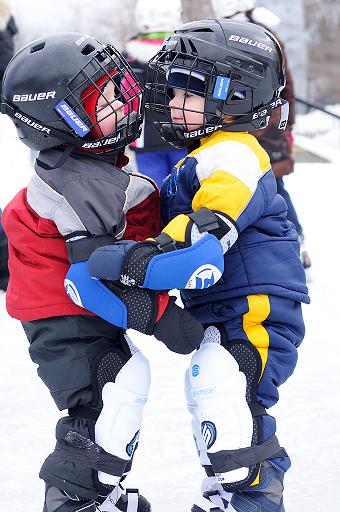 A Twins Kiss And Hug On Ice, by Myrtle H