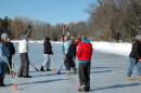 Playing Broomball on the ice, and having fun!