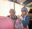 Helping out with cotton candy is sweet, but also messy!  It's a lot of fun to volunteer at the Carnival.